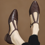 Greta – Zapatos de piel con tira en T y detalle trenzado