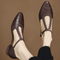 Greta – Zapatos de piel con tira en T y detalle trenzado