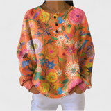 Faustine - Suéter naranja con estampado de flores colorido