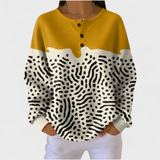 Liv - Suéter amarillo y blanco con estampado animal