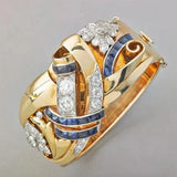 Anillo retro dorado con zirconia azul