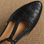 Greta – Zapatos de piel con tira en T y detalle trenzado