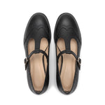Susana: zapatos tira en t brogue, color negro, vista cenital del par