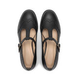 Susana: zapatos tira en t brogue, color negro, vista cenital del par